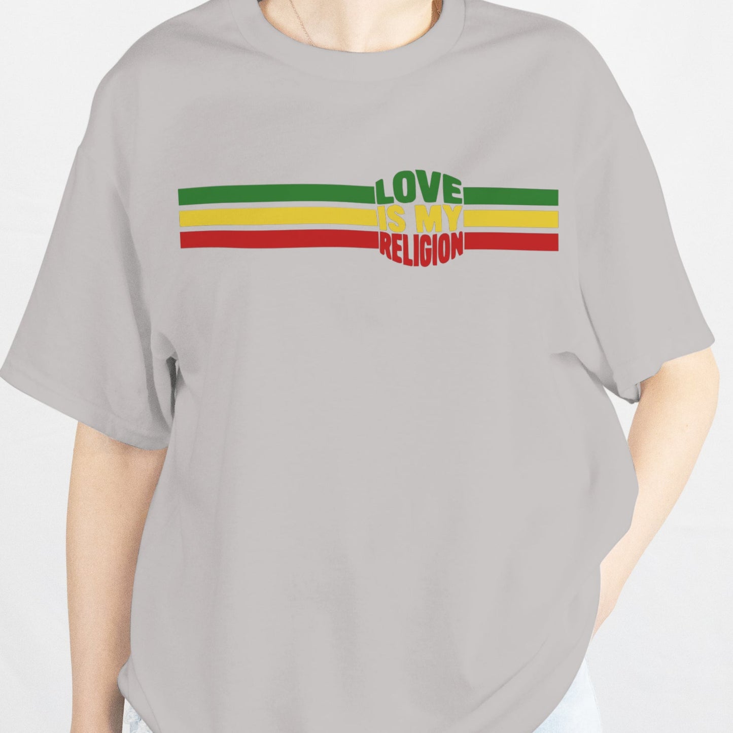 Woman wearing a gray t-shirt with colorful text design on a white background