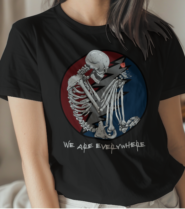 Person wearing a black t-shirt with a skeleton design and text.