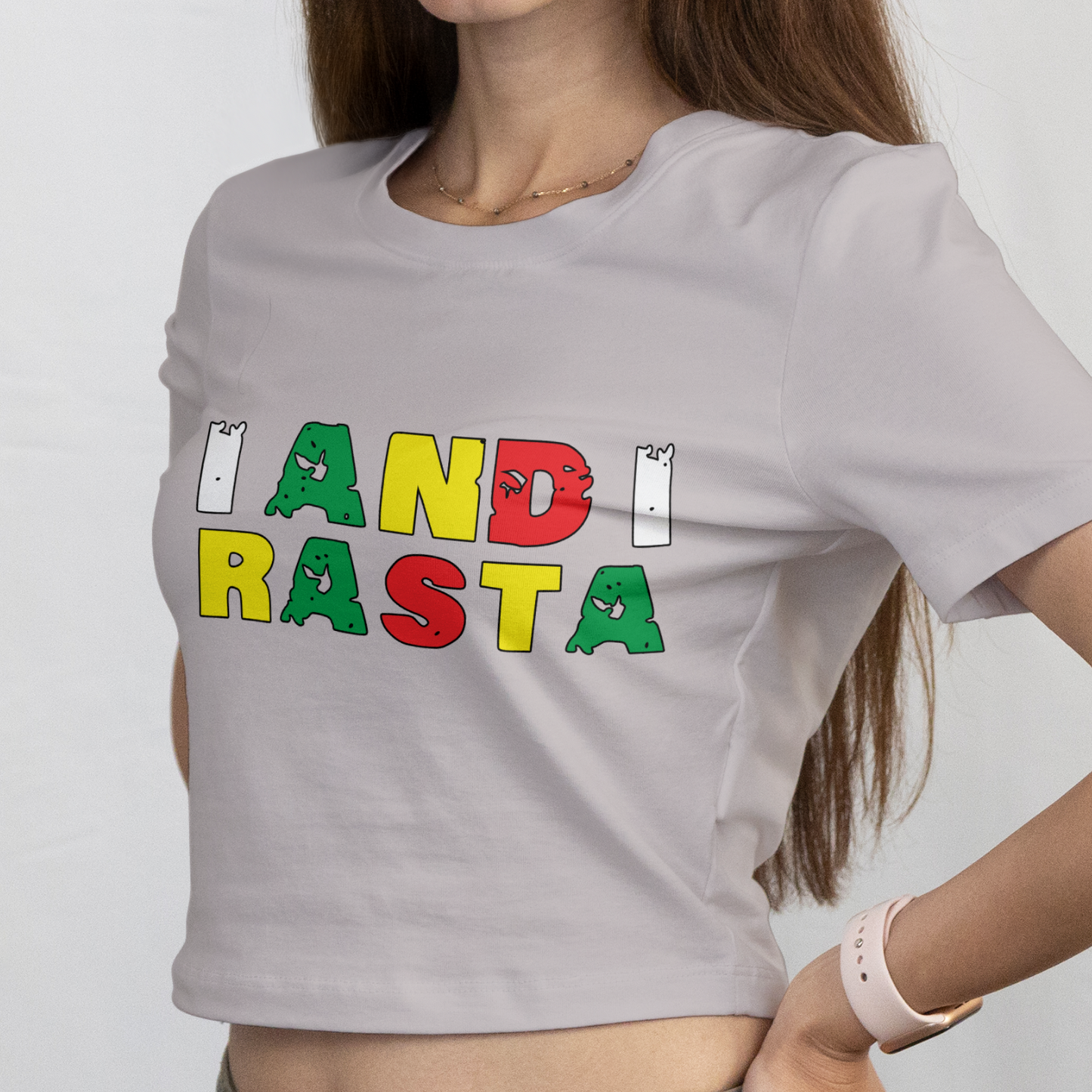 Woman wearing a gray t-shirt with colorful text on a white background