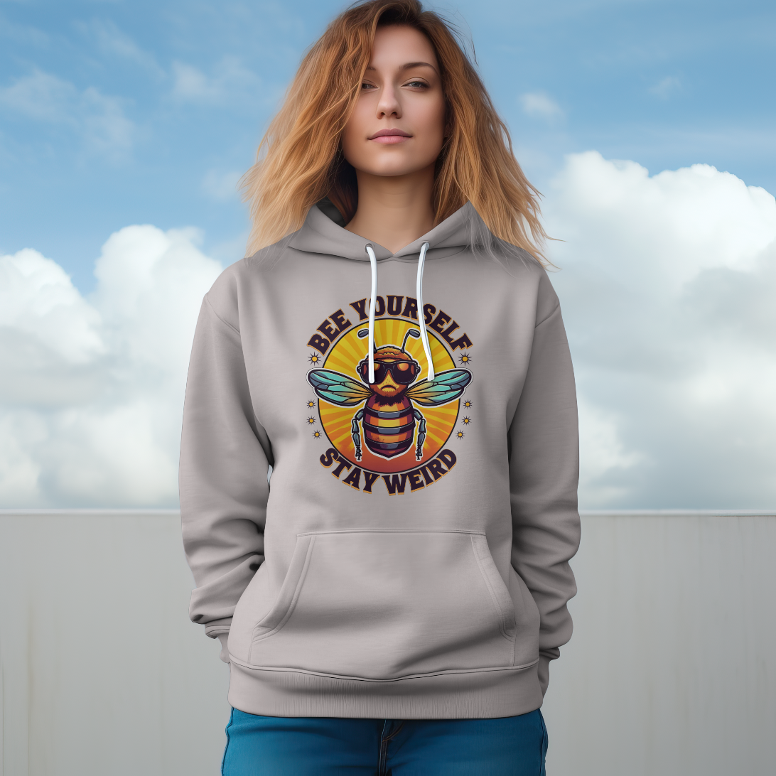 Person wearing a hoodie with a bee graphic and text against a cloudy sky.