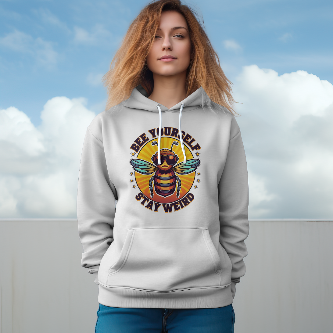 Woman wearing a hoodie with a bee graphic and text against a cloudy sky.