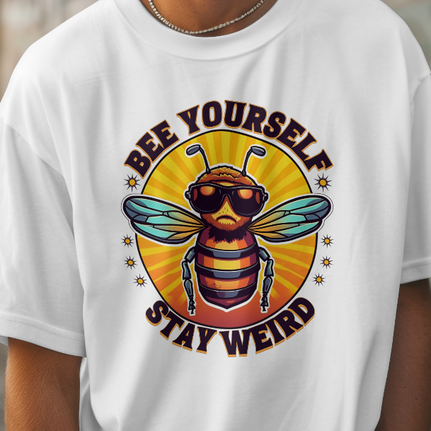 Person wearing a white t-shirt with a bee graphic and text in an urban setting
