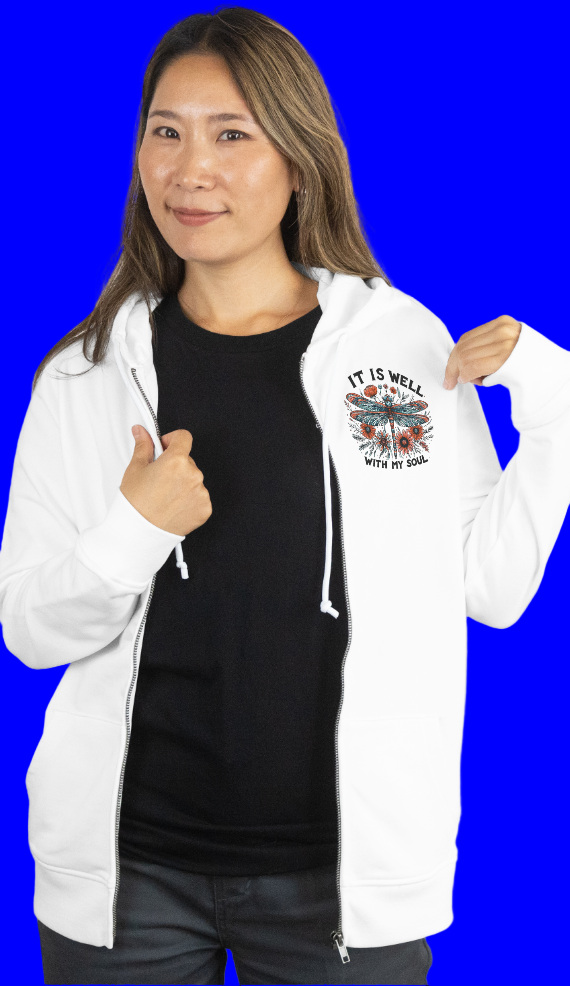 Person wearing a white hoodie with a black shirt underneath on a plain background