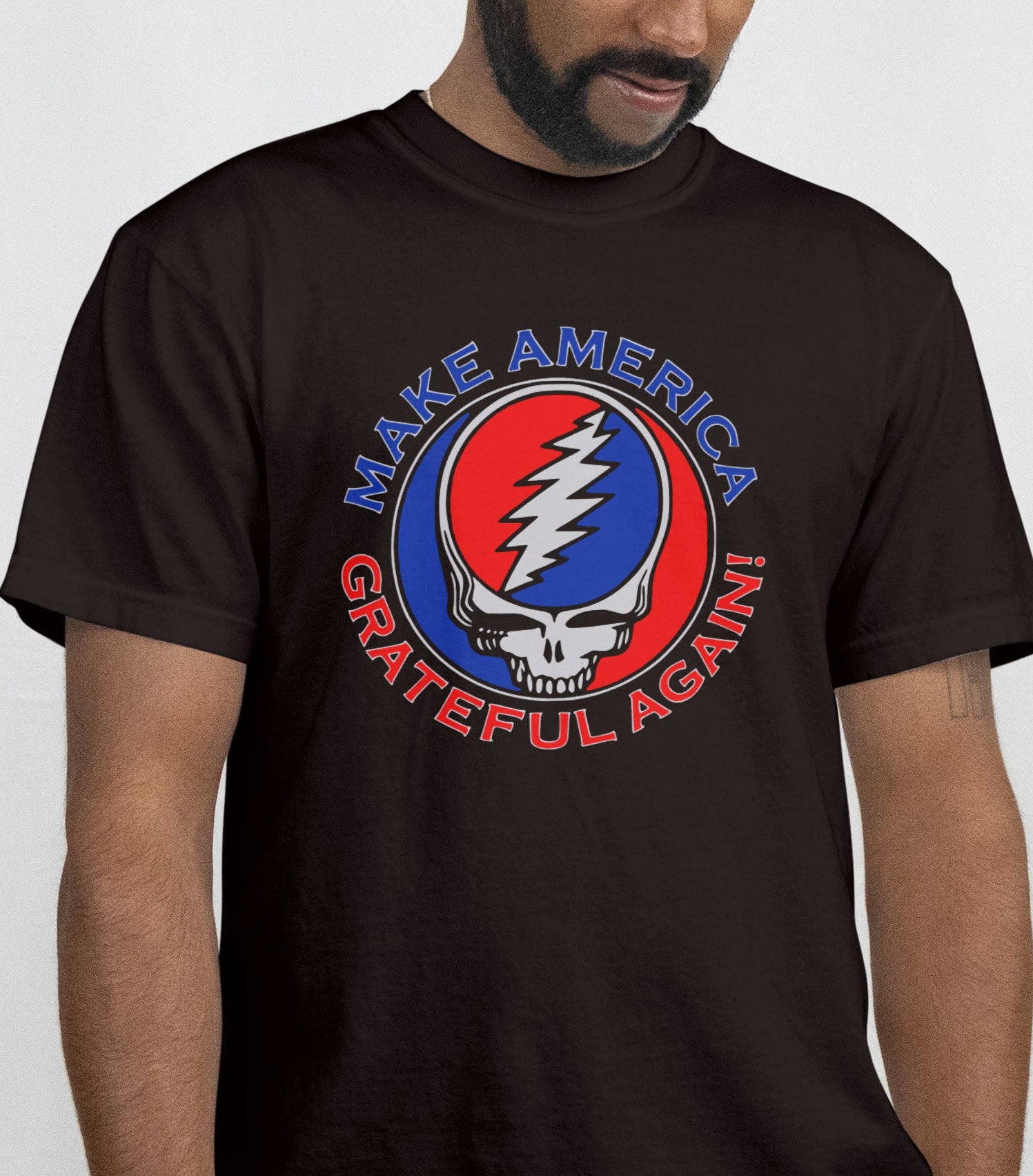 Person wearing a black t-shirt with a graphic design and text.