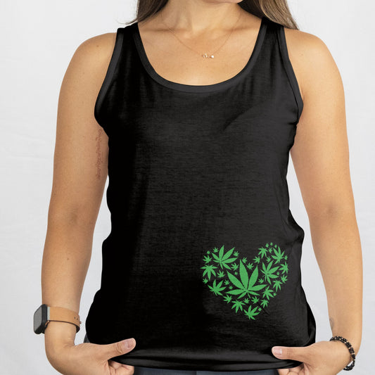 Woman wearing a black tank top with a green heart design on a white background