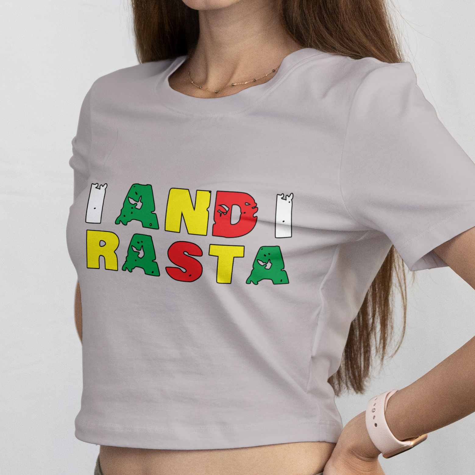 Woman wearing a gray t-shirt with colorful text on a white background