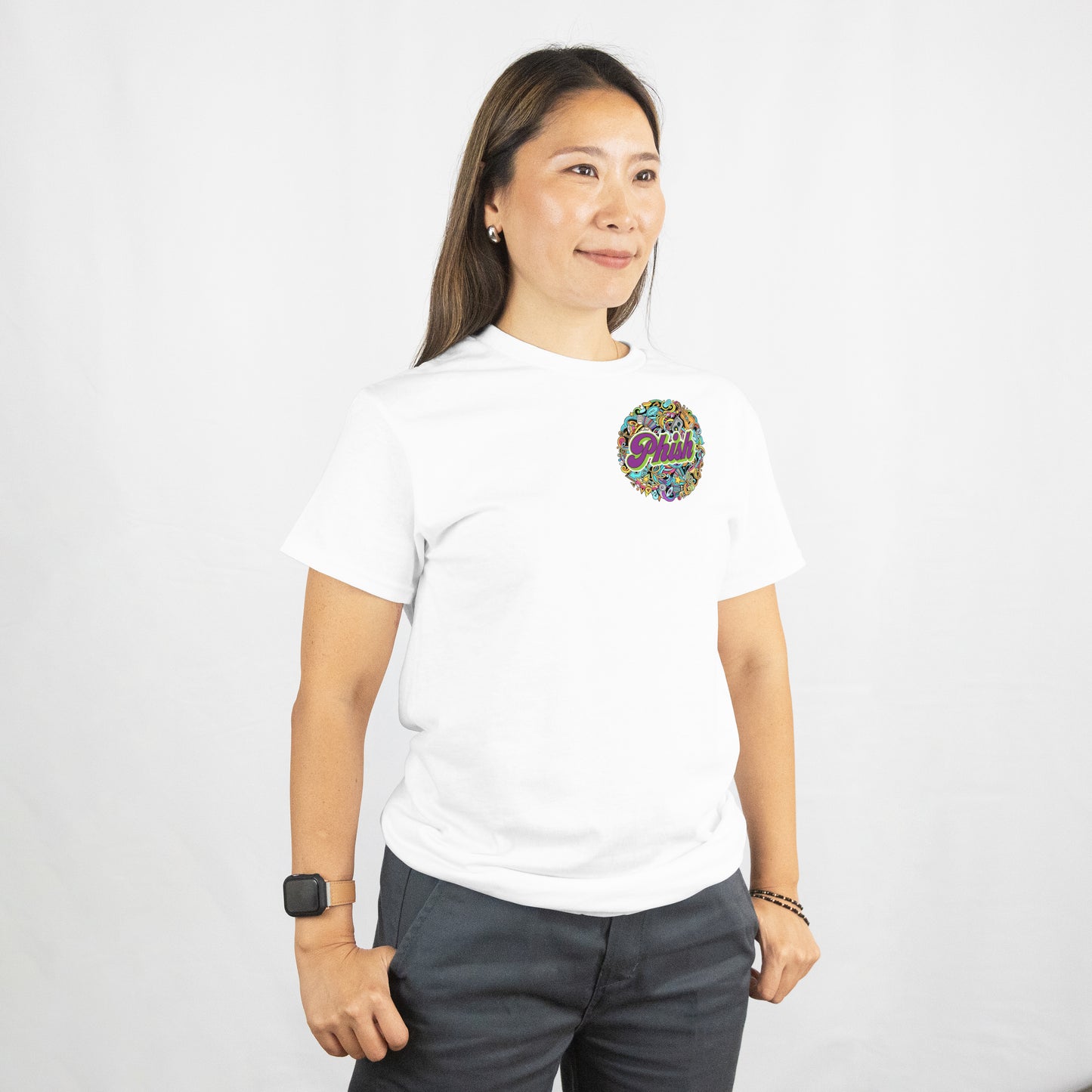 Person wearing a white t-shirt with a colorful logo on a plain background